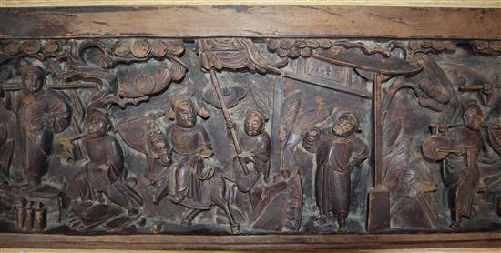 A Chinese carved hardwood figural panel length 122cm